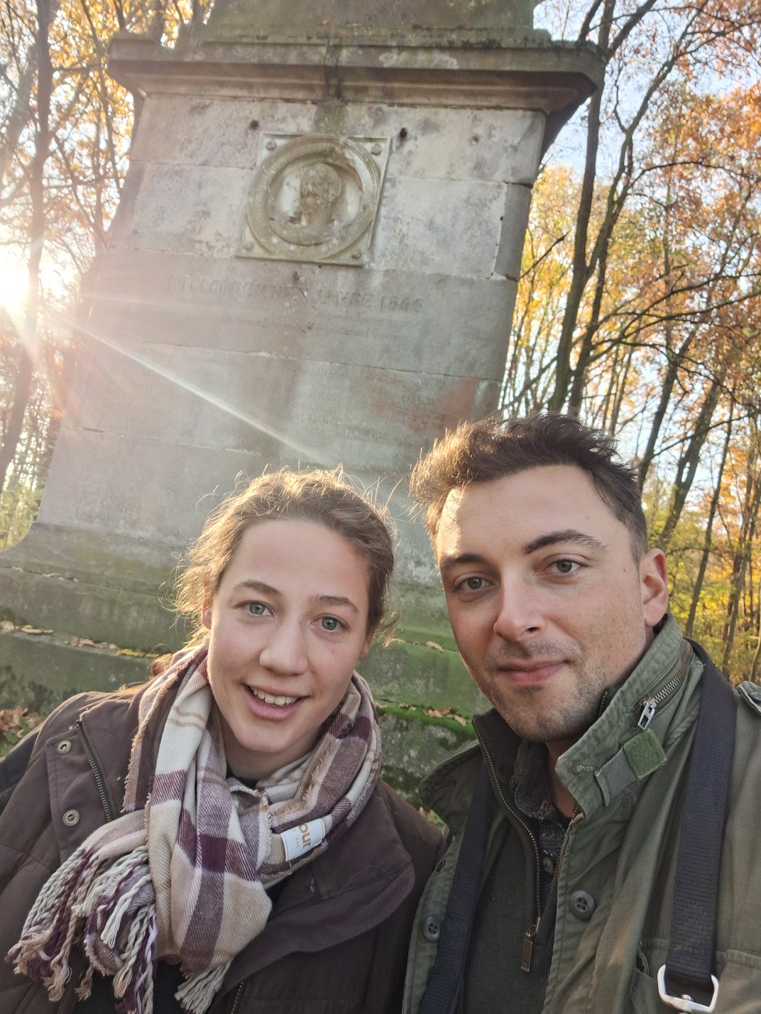 Oscar and his wife on a walk near a historical monument